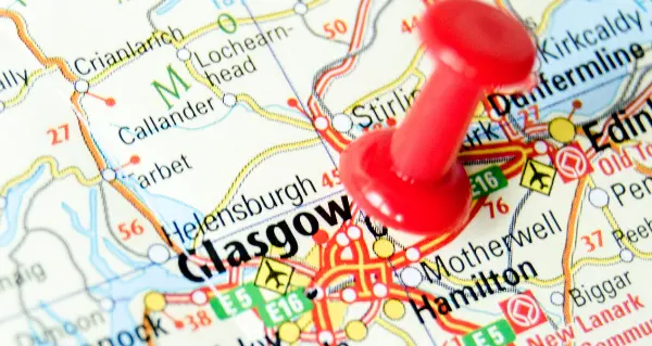 a map showing glasgow with a red pin in it